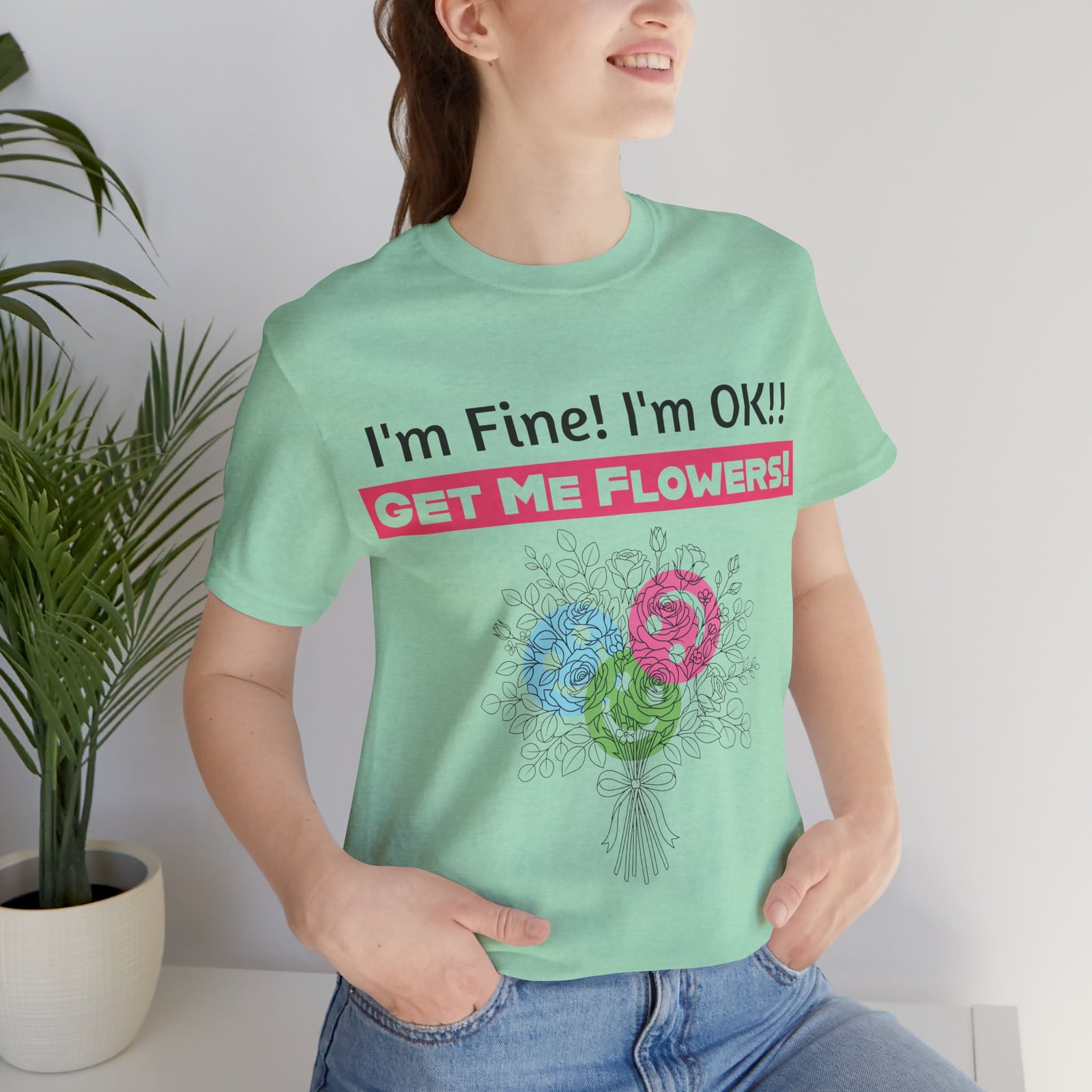 Light green crew-neck t-shirt with a colorful floral bouquet design and humorous text reading I'm Fine! I'm OK!!