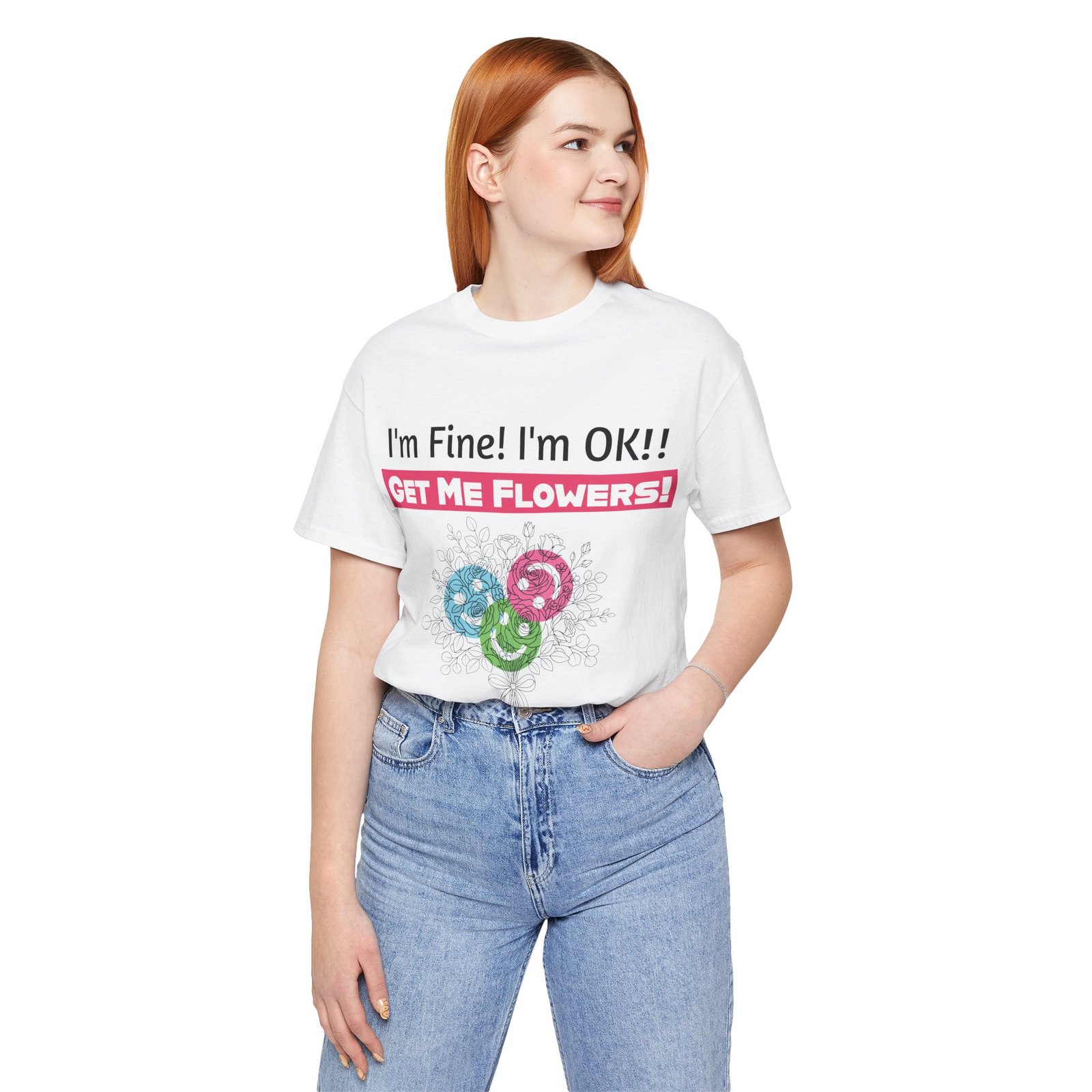Redheaded woman wearing a white T-Shirt that says "I'm Fine! I'm OK!! GET ME FLOWERS!" with colorful floral graphics.