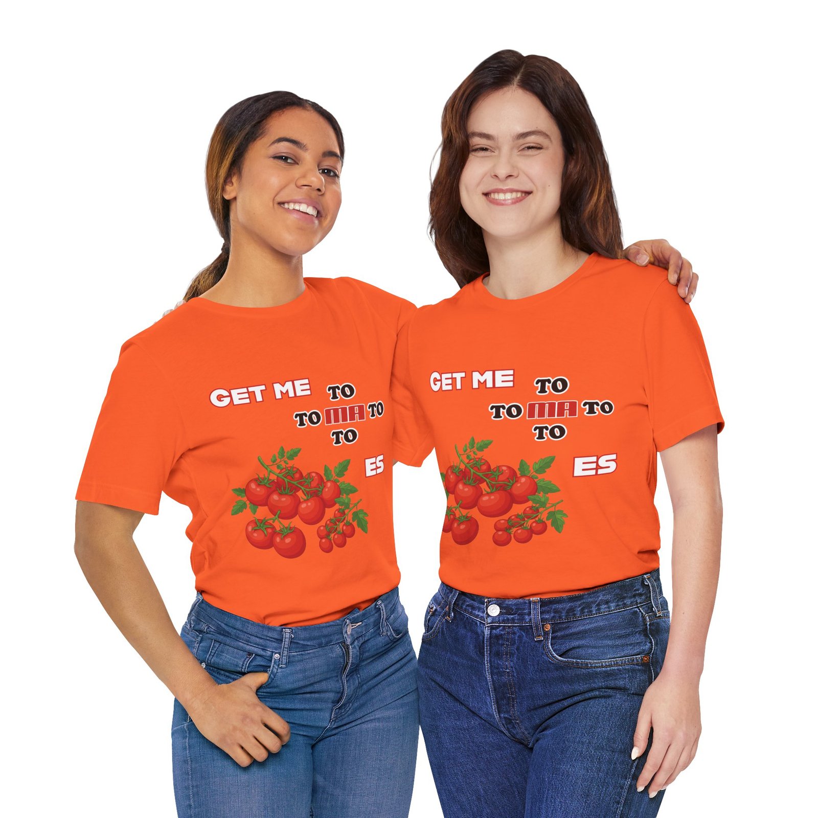 Two smiling women wearing orange 'Get Me To Ma To Toes' T-shirts featuring red tomato illustrations.
