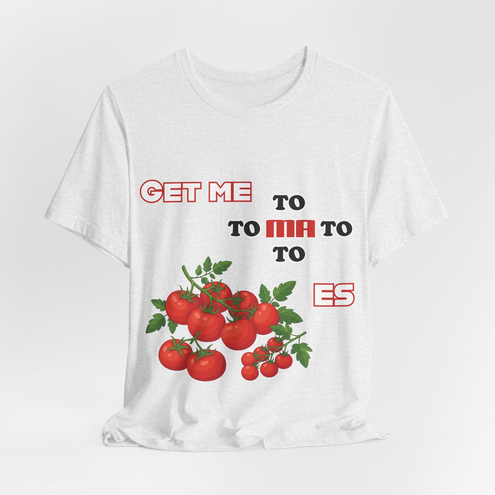 White t-shirt featuring the playful phrase "GET ME TO MA TO TOES" in red retro typography with illustrated tomato clusters.