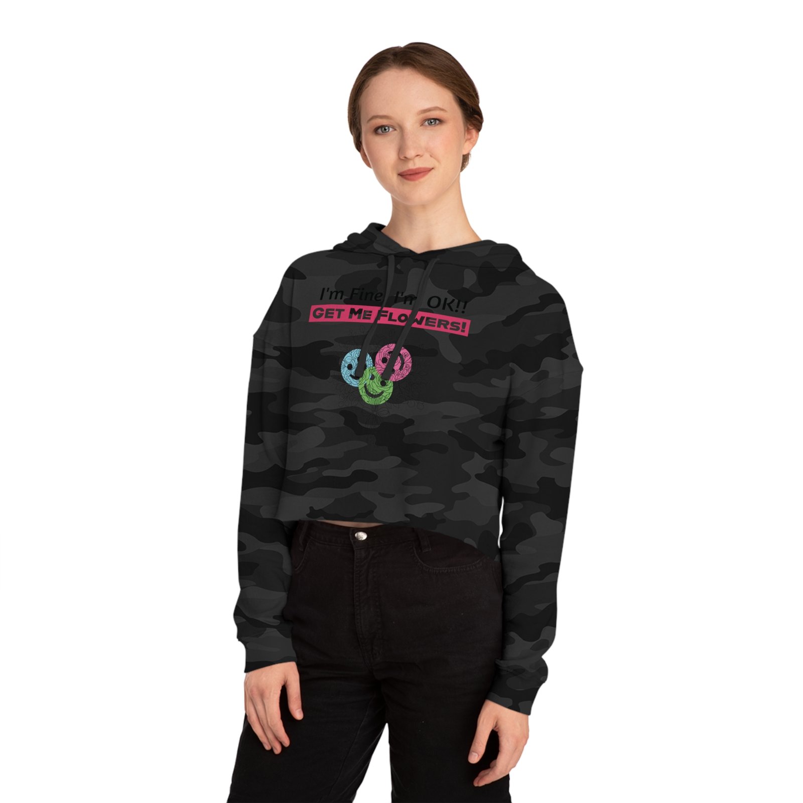 Woman wearing a black camo cropped hoodie with "I'm Fine! I'm OK!! GET ME FLOWERS!" text and floral graphic.