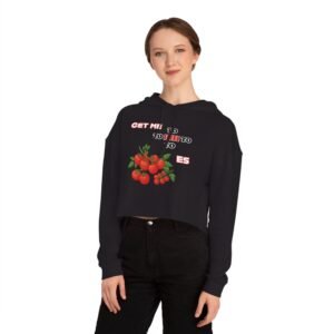 Woman wearing a black cropped hoodie with a tomato graphic and Get Me to Tomatoes text.