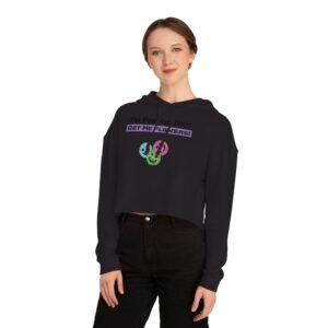 Woman wearing a black cropped hoodie with 'I'm Fine! I'm OK!! GET ME FLOWERS!' text and colorful flower graphic.