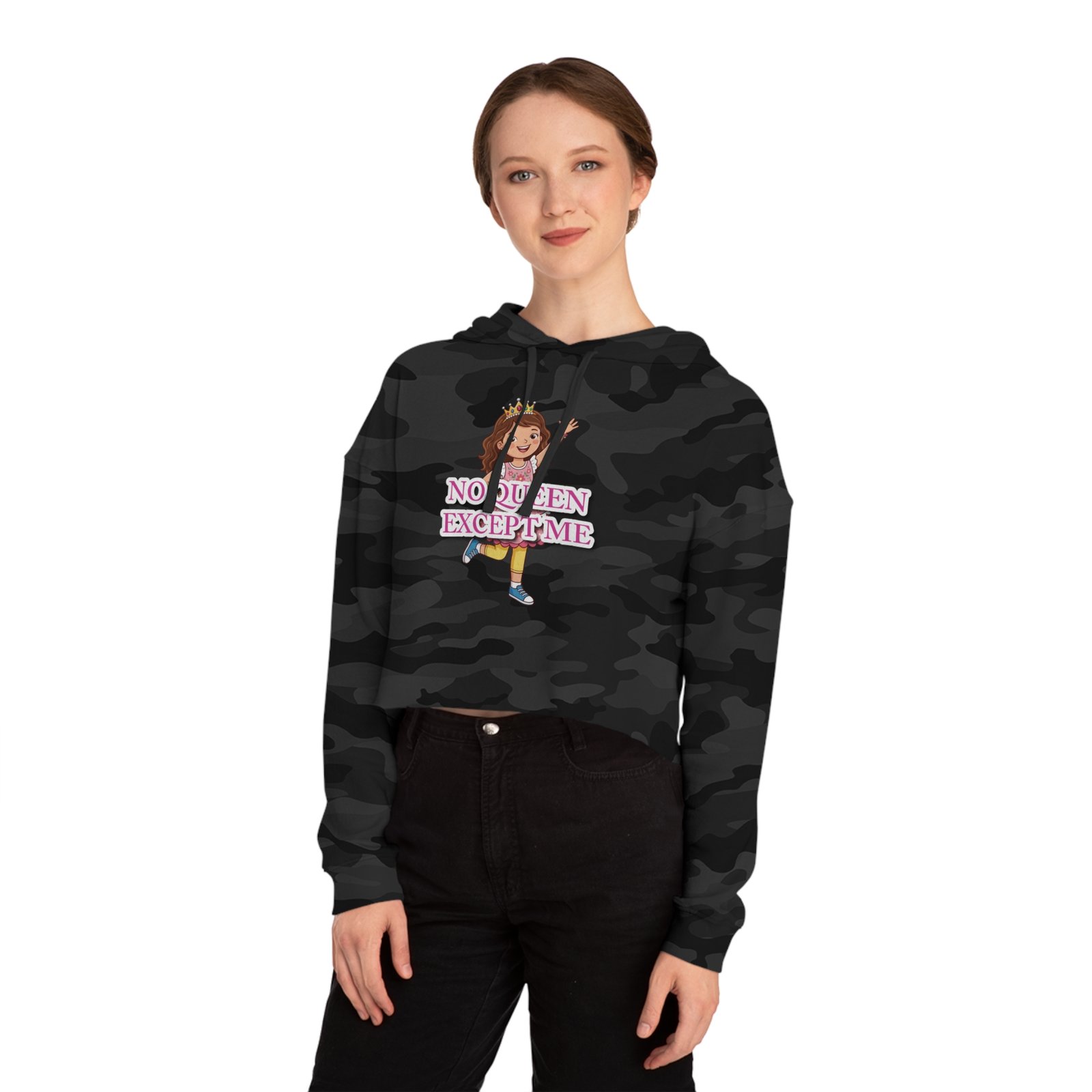 Woman wearing a camouflage print cropped hoodie featuring a colorful No Queen Except Me cartoon graphic.