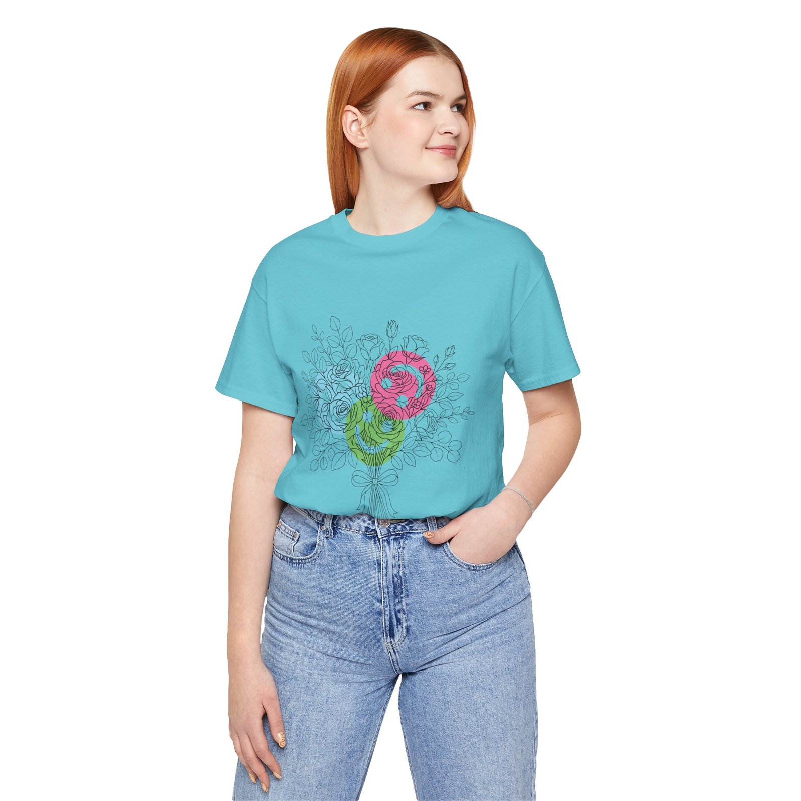 Woman wearing a light blue t-shirt with a colorful hand-drawn floral bouquet graphic in magenta, teal, and lime.