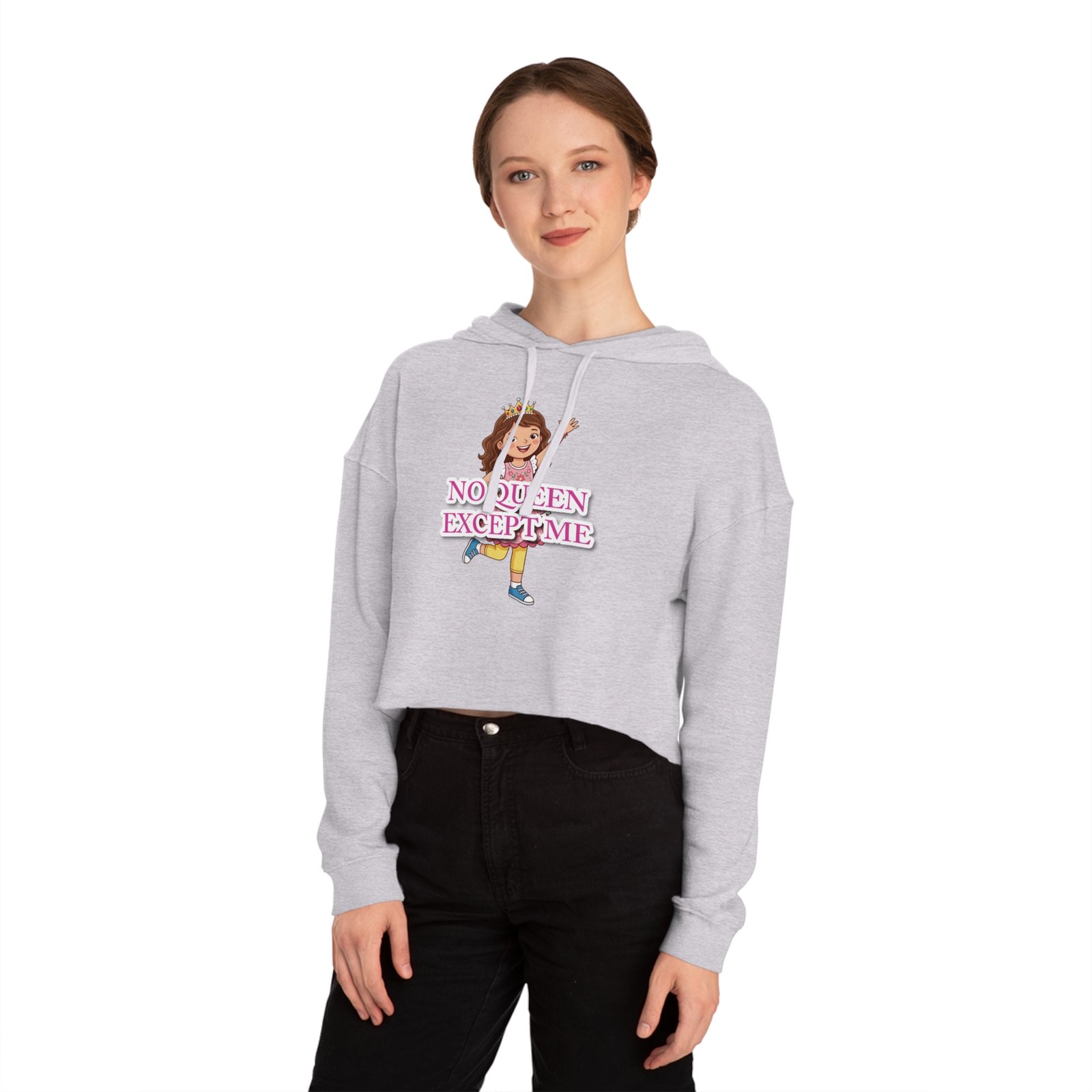 Woman wearing a light grey cropped hoodie with a colorful No Queen Except Me cartoon graphic.