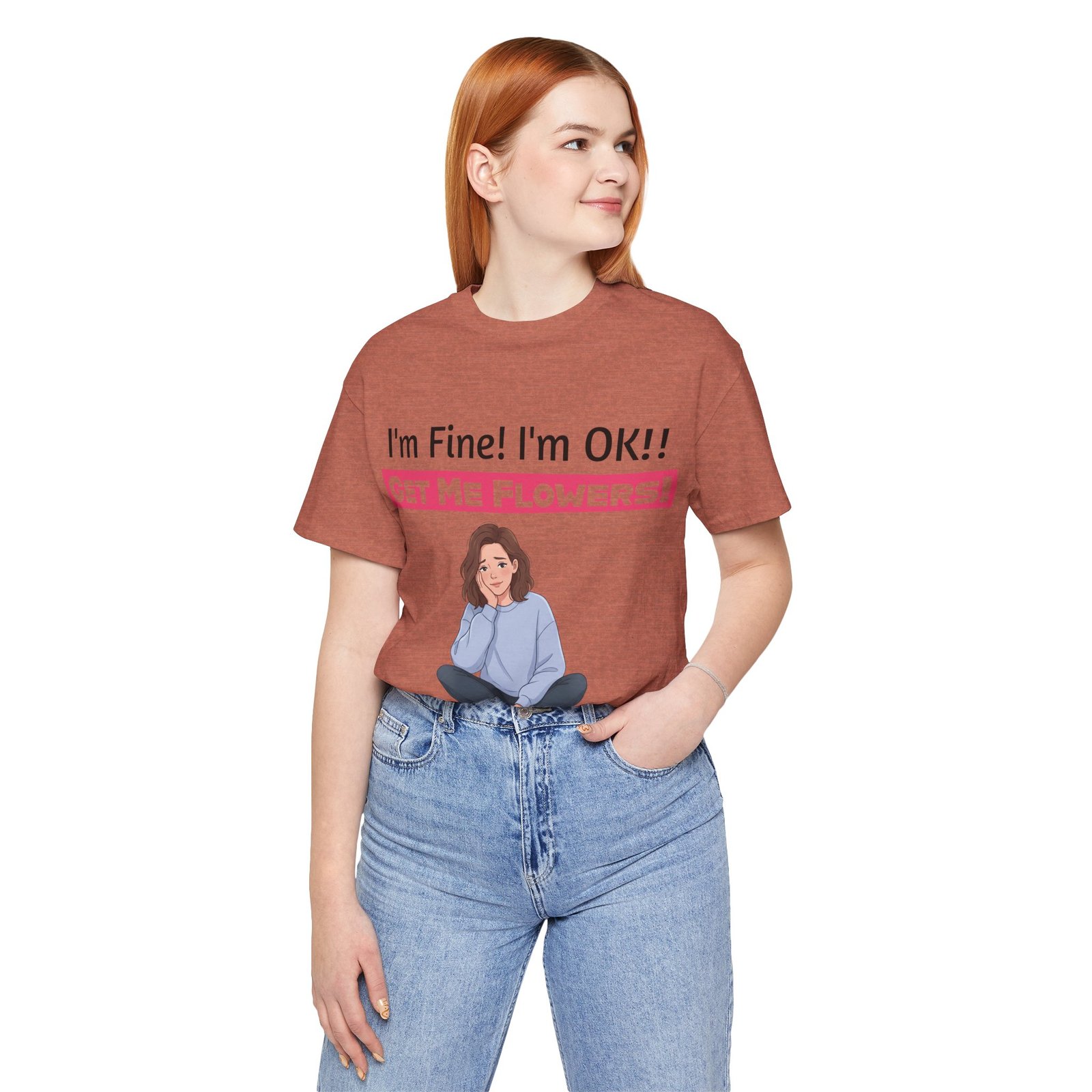 Woman wearing a rust-colored t-shirt with a funny graphic and text reading I'm Fine! I'm OK!! Get Me Flowers!